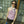 Load image into Gallery viewer, young woman standing outside wearing a mauve one-shoulder tank top, with a band that crosses over the chest and arm. Design by Alex Watson Studio. Paired with a silk scarf, little purse and sunglasses.
